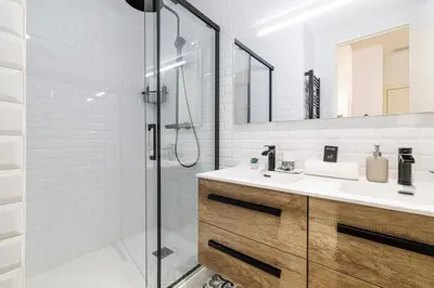 a bathroom with a sink and a shower at Chic & Cozy 2 Bdr Heart of the Old Town in Nice