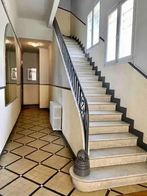 a stairway in a building with a spiral staircase at Nice Sea View 2 bedroom apartment in Nice