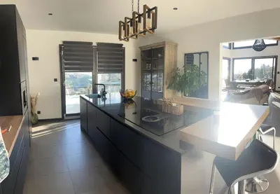 a kitchen with a large island with a counter top at Villa location saisonniere in Nice