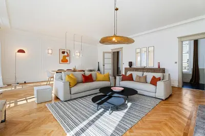 a living room with a couch and a table at Nice Renting - VICTOR - Historic Palace Luxury 3 Bedrooms in Nice