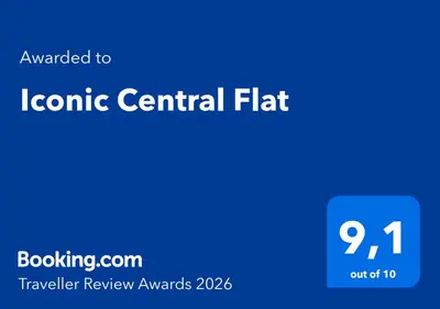 a living room with a table and a couch at Iconic Central Flat in Nice