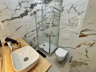 a bathroom with a sink and a shower and a toilet at Charming apartment in Nice in Nice