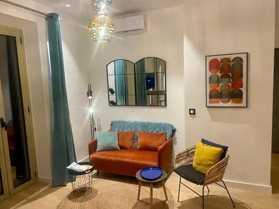 a living room with a couch and a chair at Suite ana in Nice