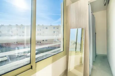 a room with a window with a view of a city at 2 pièces Calme Proche de la mer Parking en sous-sol in Cagnes-sur-Mer