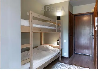 a bedroom with two bunk beds in a room at Nice Absea Belles Terres Studio in Nice