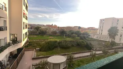 a view of a park from the balcony of a building at Nice french Riviera, parking gratuit, Tram L1 AU PIED de l'immeuble in Nice