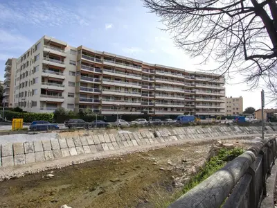a large apartment building in front of a parking lot at Apartment Cagnes Provencal by Interhome in Cagnes-sur-Mer