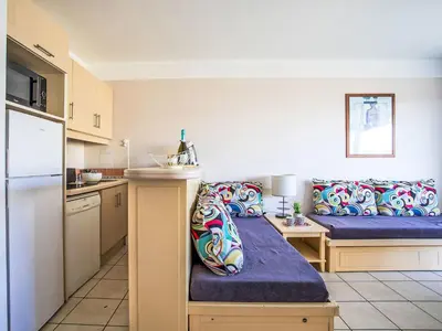 a kitchen with two beds in a room at Apartment Heliotel Marine-2 by Interhome in Saint-Laurent-du-Var