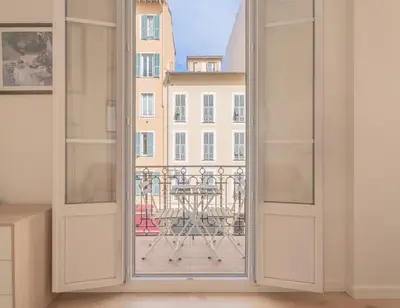 an open door with a view of a balcony at Studio Cosy à Nice in Nice
