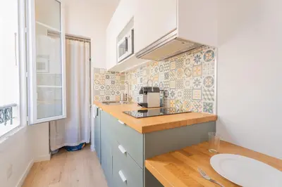 a kitchen with a sink and a counter top at Studio Cosy à Nice in Nice