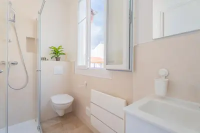 a bathroom with a toilet and a sink and a shower at Studio Cosy à Nice in Nice
