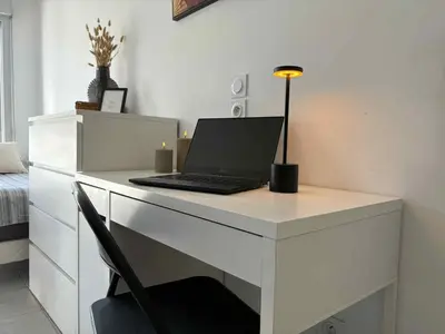 a white desk with a laptop computer on it at Cosy Apartment Vauban in Nice