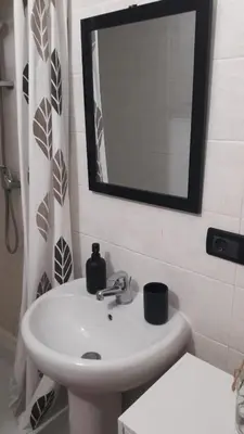 a bathroom with a sink and a mirror and a toilet at F1 Cozy & Stylish in Hyper-Centre in Nice