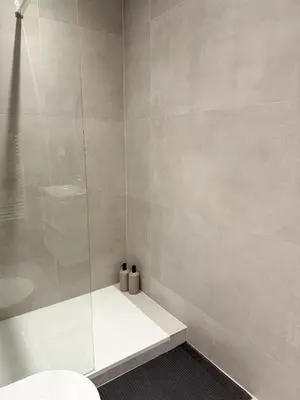 a bathroom with a glass shower with a toilet at Port de Nice, Appartement 4pers emplacement idéal tout équipé balcon in Nice