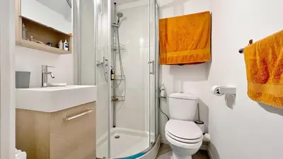 a bathroom with a shower and a toilet and a sink at Le Ciel in Nice