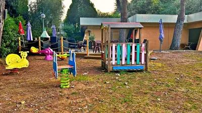 a childrens playground with a play equipment in a yard at Le Ciel in Nice