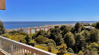 a balcony with a view of a city and the ocean at Vista Mare in Nice