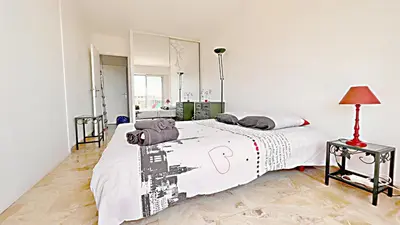 a bedroom with a large bed with a white bedspread at Vista Mare in Nice