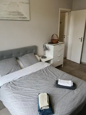 a bedroom with a bed with two towels on it at Studio central Nice in Nice