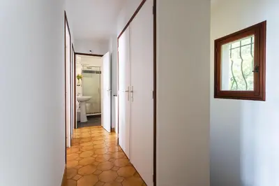 a hallway leading to a bathroom with a window at LA SOLEILLADE VI4451 By Riviera Holiday Homes in Èze