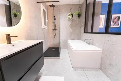 a bathroom with a sink and a toilet and a shower at Nice Centre - Loft - Balnéo 1 in Nice