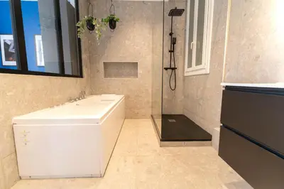 a bathroom with a white sink and a shower at Nice Centre - Loft - Balnéo 1 in Nice