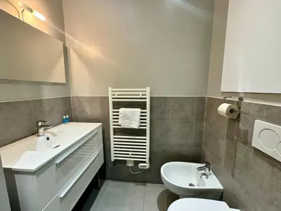 a bathroom with a sink and a toilet at Suite Doulce France FSHH in Nice