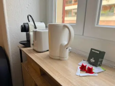 two coffee cups sitting on a counter next to a window at ⁂ Appartement élégant et central à Nice in Nice