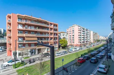 a street with cars parked in a city with buildings at #37 1BDR Bagatelle, Promenade, sea front Balcony & AC in Nice