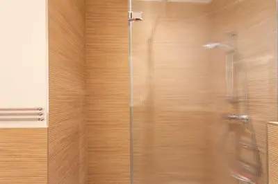 a shower with a glass door in a bathroom at #26 Idealy located flat AC 2mins walk to Sea balcony in Nice