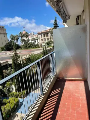 a balcony of a building with a gate and a street at #26 Idealy located flat AC 2mins walk to Sea balcony in Nice