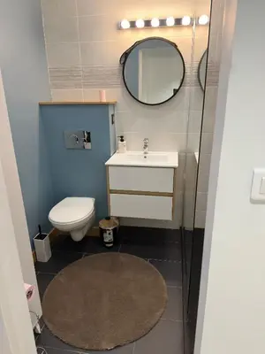 a bathroom with a toilet and a sink and a mirror at Spacious Riviera Studio in Nice