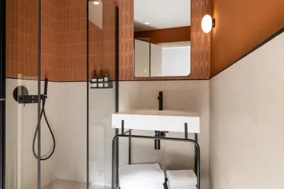 a bathroom with a sink and a shower at Ikonik Marengo in Nice