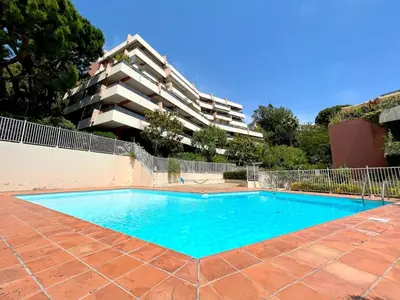 an empty swimming pool in front of a building at La Pastourelle Studio Close to Sea Pool Parking in Nice