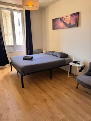 a bedroom with a bed in the middle of a room at Hype-Center Balcony 3BR AC Near Tram for6 guests in Nice