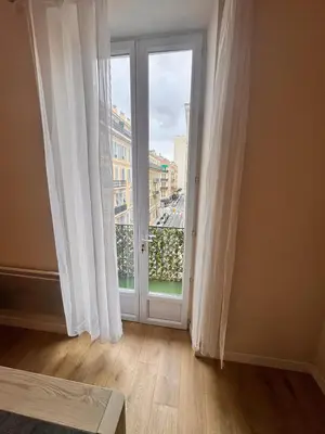 an empty room with a door and a window at Hype-Center Balcony 3BR AC Near Tram for6 guests in Nice