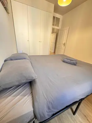 a large bed in a room with white cabinets at Hype-Center Balcony 3BR AC Near Tram for6 guests in Nice