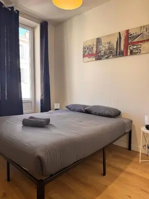 a bedroom with a bed with two pillows on it at Hype-Center Balcony 3BR AC Near Tram for6 guests in Nice