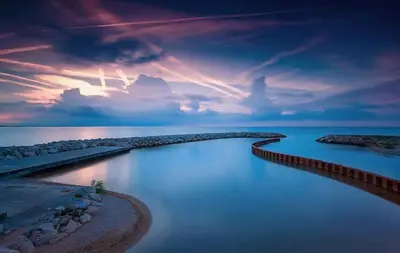 a sunset over a body of water with a cloudy sky at Villa La Mer new apartment 75 m2 very quiet in Cagnes-sur-Mer