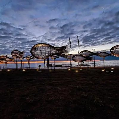 a group of structures on the beach at night at Villa La Mer new apartment 75 m2 very quiet in Cagnes-sur-Mer