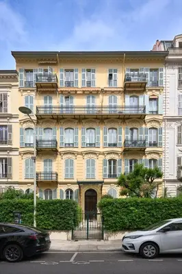 a large building with cars parked in front of it at Sunlight Properties - Gisele - Nice hyper central, 1 bedroom with large living room in Nice