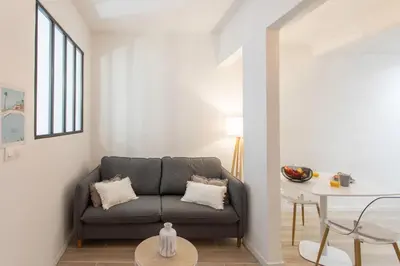 a living room with a couch and a table at #16 1BDR Flower market, Old Town, 1min beach AC in Nice