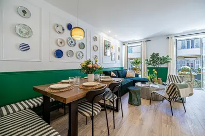a dining room with a table and chairs at NEW! Remodeled & Spacious 4 Bedroom - 3 Bath - Heart of Nice - AC in all rooms - With a large elevator in Nice