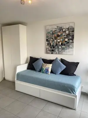 a bedroom with a bed with blue sheets at Ma place au sud Nice 604 in Nice