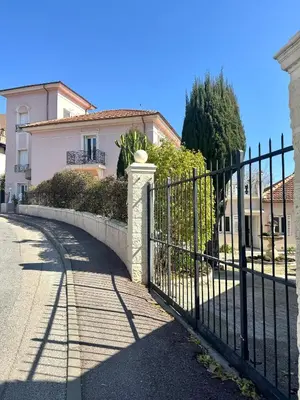 a wrought iron fence in front of a house at Hotel La Citadelle in Villefranche-sur-Mer