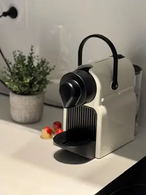 a toaster sitting on a counter next to a plant at Bel appartement au calme hyper centre Nice in Nice