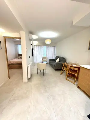 a living room with a couch and a table at Appartement Nice Magnan promenade in Nice