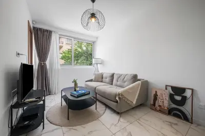a living room with a couch and a table at Nice - Mordern Apartment Sea Close in Nice