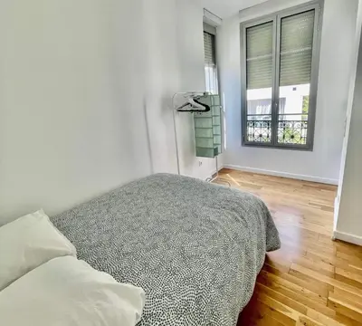 a bedroom with a bed and a window at Nice two-rooms with balcony in Nice in Nice