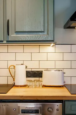 two pots and pans sitting on top of a kitchen counter at Magnifique Appartement 3P in Nice